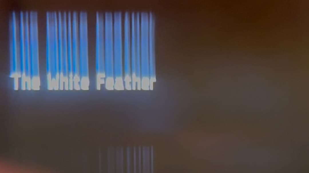 An image titled: The White Feather. It has a dark gray/brown background and the text The White Feather on the left. The text is glowing white, and it has a blurry trail up to the top of the image.